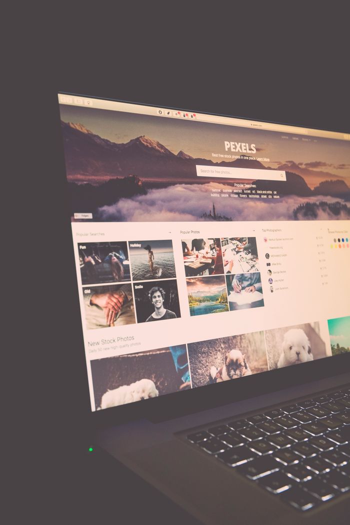 A laptop display showing the Pexels website, perfect for stock photo needs.